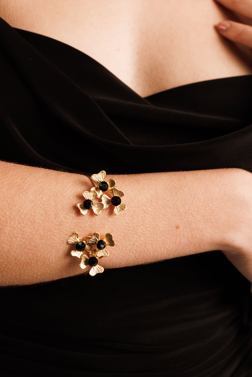 gold floral bracelet with black crystals 