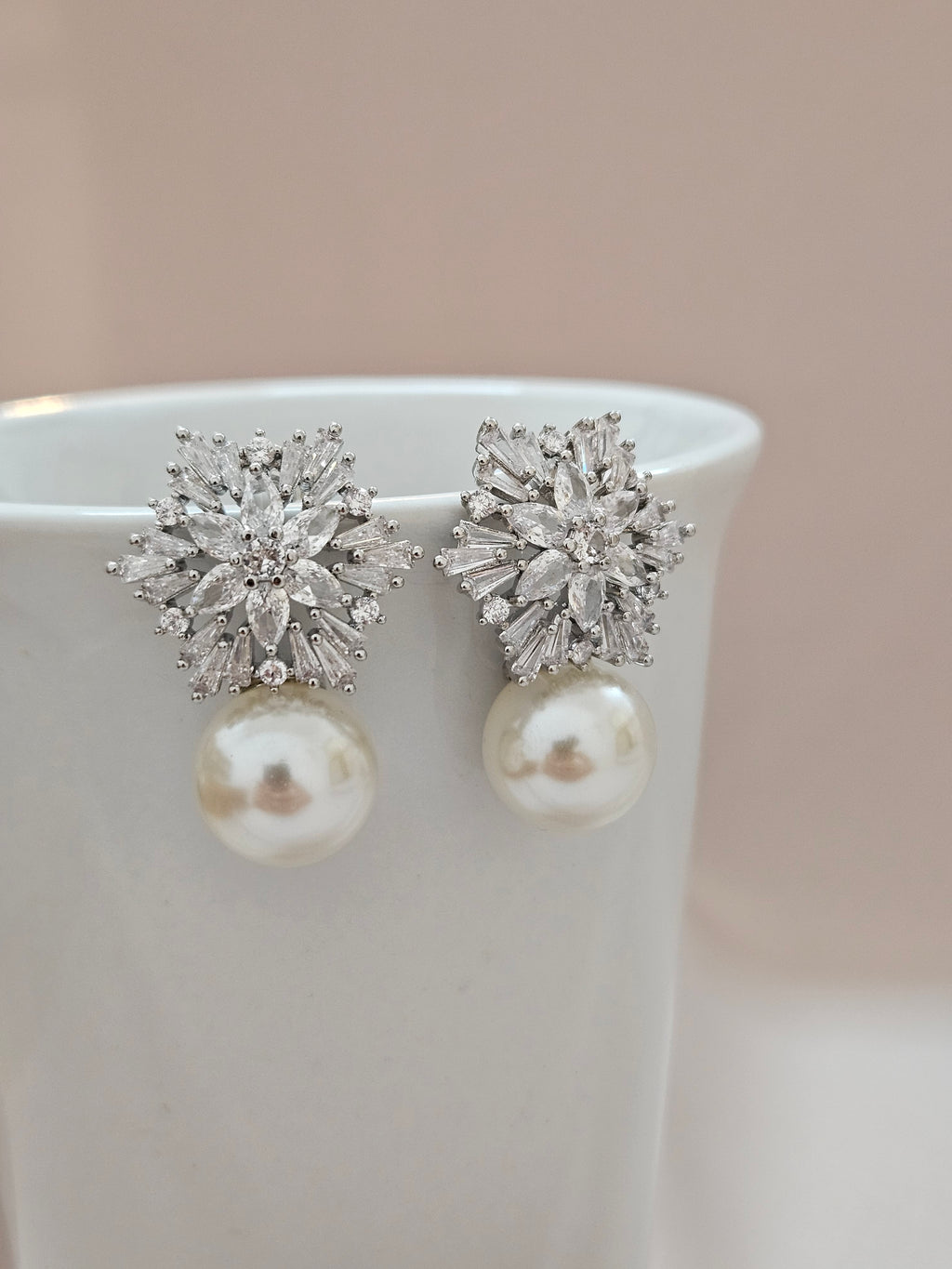 geometric silver cubic zirconia and pearl stud earrings for brides and weddings